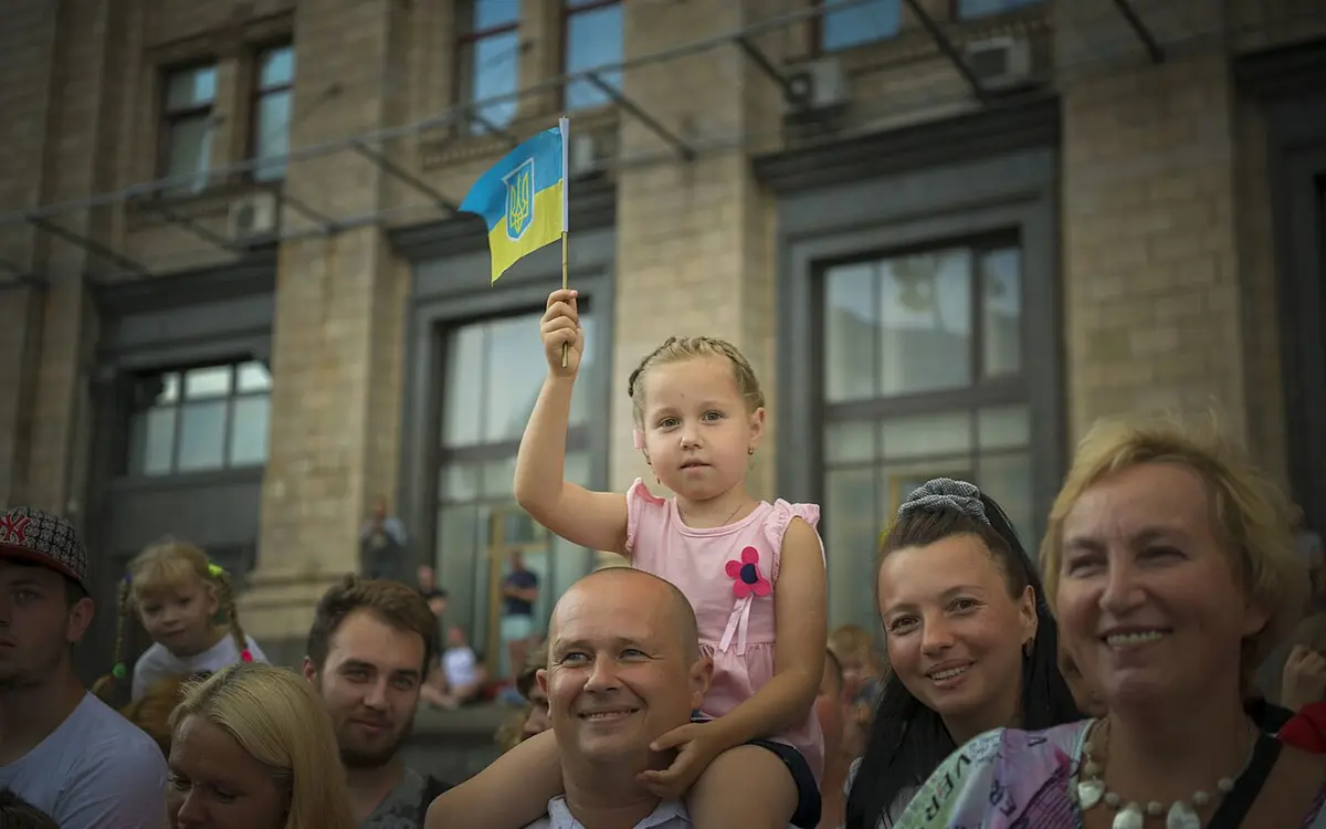 People carrying Ukrainian flags during an Independence Day gathering